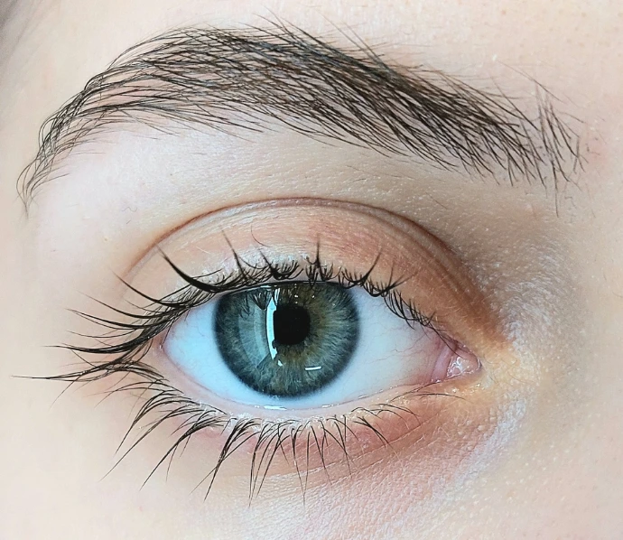 A close up of a person's blue eye